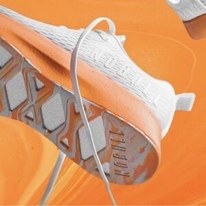 NOBULL Journey running shoe in white with an orange midsole